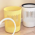 Three Yellow White And Blue Striped Plastic Waste Bins Near White Cabinet In Public Facility