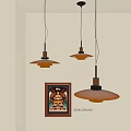 Modern Amber Pendant Lights With Wooden Metal Design Above Framed Artwork On White Wall
