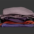 Stacked Colorful Textured Towels In Various Hues Purple Red And Blue