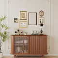 Wooden Sideboard With Table Lamp Radio Decor And Potted Plant Against Wall With Frames