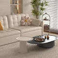 Modern White Sofa with Pillows and White Black Round Coffee Tables in Living Room Interior