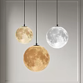 Unique Moon Shaped Chandeliers With Textured Surfaces Hanging In Modern Interior