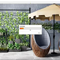 Cozy Outdoor Sofa with Wicker Frame Green Plant Wall and Umbrella in Garden