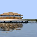 Golden Circular Building With Petal Roof On Waterfront And Green Lawn Pathway
