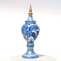 Blue and White Ceramic Vase With Golden Spire Top And Decorative Motifs