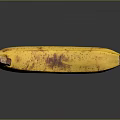 Ripe Yellow Banana With Brown Spots On Black Surface Showing Clear Reflection