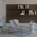 Stylish Modern Leisure Chair in Interior with Grey Blanket Brown Shelves and White Table