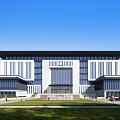 Modern Office Building With Symmetrical Facade Glass Curtain Walls Green Lawns Under Blue Sky