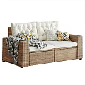 Rattan Outdoor Sofa with White Cushions Geometric Pillows and Throw Blanket
