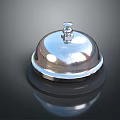 Shiny Chrome Service Bell With Polished Surface And Reflective Base On Dark Background