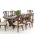 Oval Dark Wood Dining Table Set With Carved Chairs Light Padded Seats Green Plant Centerpiece