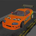 Orange Modified Sports Car Featuring Rear Spoiler Body Decals On Asphalt With Yellow Lines