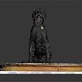Black dog with red collar sits on round platform with gear patterns and orange edge