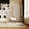 Modern White Woven Chair with Cushion in Room with Beige Rug Decorative Screen and Artwork
