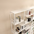 Modern Open White Shelving Unit With Books Decorative Items And Green Plants For Home Organization