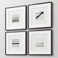 Four Black And White Framed Artworks Hanging On Minimalist Wall Decor