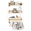 Kids Clothes Hanging On Wooden Shelves With Toys And Decorative Lights
