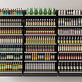 Neatly Organized Retail Display Shelves Stocked with Various Colored Bottled Products