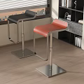 Modern Black and Orange Bar Stools with Metal Bases by Window and Bookshelf
