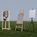 Art Painting Supplies With Wooden Easels And Blank Canvas On Grass Field