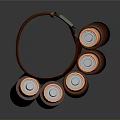 Brown Circular Holder With Multiple Brown Bottles Orange Tops And Black Bases