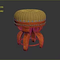 Decorative Stool With Beige Padded Seat Riveted Edge And Orange Carved Legs
