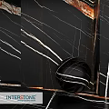 Black Marble Construction Component With White Veins And Spherical Decor
