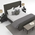 Double Bed with Gray Headboard White Mattress Pillows Nightstands Lamps End Bench and Gray Rug