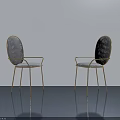 Elegant Chairs With Gold Frames And Patterned Backrests In Modern Interior Space