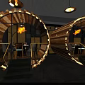 Modern Restaurant Interior Featuring Cylindrical Wooden Structures Staircases And Warm Lighting 3d model