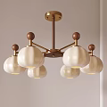 Modern Brass Chandelier Featuring Five White Glass Globe Pendant Shades For Interior Decor