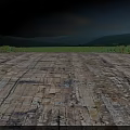 Construction Site Featuring Weathered Concrete Slabs Cracks Green Vegetation Low Hills Under Blue Sky
