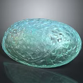 Green Oval Architectural Decorative Element With Intricate Carvings And Glossy Surface