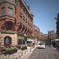 European Style Commercial Street With Red Brick Buildings Cafes Green Umbrellas And Outdoor Seating