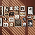 Interior Photo Wall With Various Frames And Different Designed Photos On Brown Wall