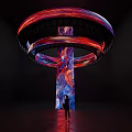 Large Colorful Art Installation With Spiral Rings Red Blue Textured Pillar And Light Effects
