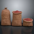 Three Burlap Sacks With Red Grains Food In Different Sizes On Dark Surface
