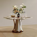 Elegant Round Dining Table With Fresh Flower Arrangement Wine Glasses And Fruits