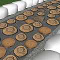 Natural Wooden Log Slice Stepping Stones On Gravel Ground With Purple Flowers And Grass