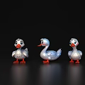 Three Cute White Toy Ducks With Orange Feet On Black Background