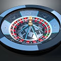 Household Roulette Wheel With Blue Black Red Numbered Slots And Golden Axis