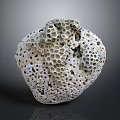 Intricate Stone Sculpture Carving With Porous Surface And Artistic Hollow Patterns