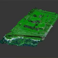 Coastal Industrial Building Complex with Dome Structures Near Ocean Water and Green Vegetation Areas