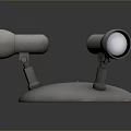 Three Silver Metal Spotlights With Adjustable Stands On Round Base