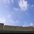 Modern Multi Storey Industrial Factory Exterior With Road Vehicles Pedestrians And Trees