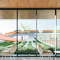 Contemporary Office Complex With Glass Curtain Walls And Urban Street Pedestrians At Dusk