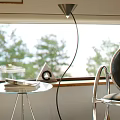 Minimalist Leisure Chair By Window With Floor Lamp Small Round Table And Pine Tree Scenery