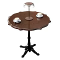 Elegant Wooden Round Dining Table With Carved Edge Black Legs Coffee Cups And Table Lamp