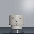 Minimalist White Ceramic Decorative Ornament Set With Facial Features On Gray Surface