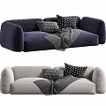 Two Seater Sofa In Navy And Gray With Black White Patterned Pillows And Gray Blanket
